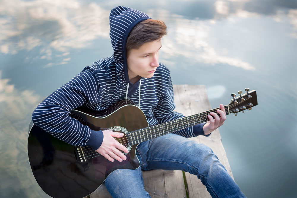 Teenager Playing Guitar